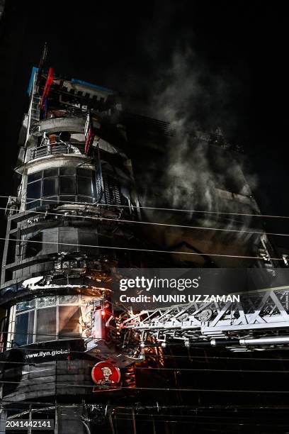 Firefighters work to extinguish a fire in a commercial building that killed at least 43 people, in Dhaka, on February 29, 2024. At least 43 people...