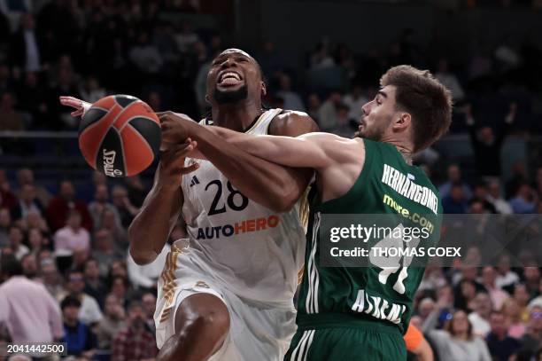 Real Madrid's French forward Guerschon Yabusele drives against Panathinaikos Athens' Spanish forward Juancho Hernangomez during the Euroleague...