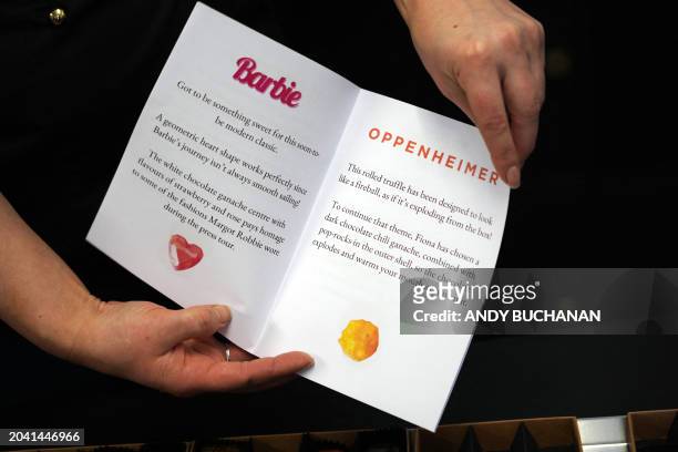 Photograph taken on February 14, 2024 shows the text presentations for the vegan chocolates created in honour of the movies "Barbie" and...