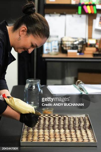 Chocolatier and owner of Fetcha Chocolates, Fiona McArthur prepares the vegan chocolates created in honour of the movie "Poor Thing" for the 2024...