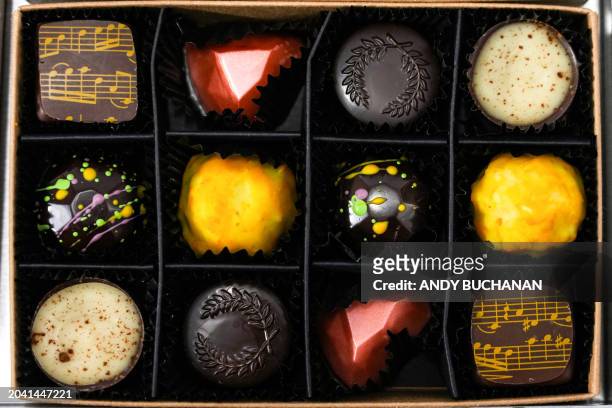 Photograph taken on February 14, 2024 shows the vegan chocolates created in honour of the movies "Maestro" , "Barbie" , "The Holdovers" , "Poor...