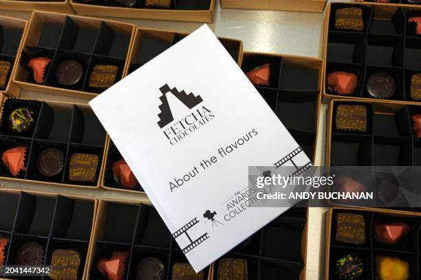 Photograph taken on February 14, 2024 shows boxes containing the vegan chocolates made by Chocolatier and owner of Fetcha Chocolates, Fiona McArthur,...