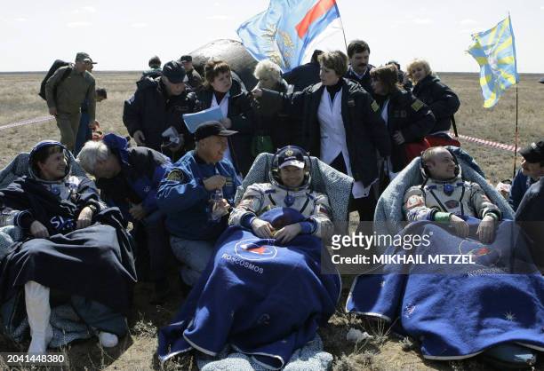Software designer and space tourist Charles Simonyi , US astronaut Mike Fincke , and Russian cosmonaut Yuri Lonchakov sit in chairs shortly after...