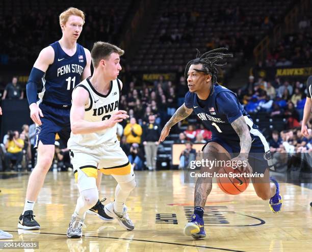 Penn State guard Ace Baldwin Jr. Drives to the basket as Iowa guard Brock Harding defends during a college basketball game between the Penn State...