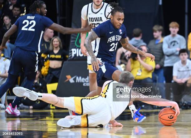 Iowa guard Josh Dix reaches out for a loose ball during a college basketball game between the Penn State Nittany Lions and the Iowa Hawkeyes on...