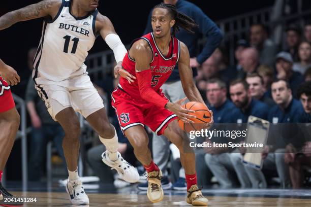 St John's Red Storm guard Daniss Jenkins looks for an open teammate during the men's college basketball game between the Butler Bulldogs and St....