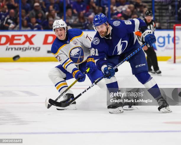 Erik Cernak of the Tampa Bay Lightning against Tage Thompson of the Buffalo Sabres during the second period at Amalie Arena on February 29, 2024 in...