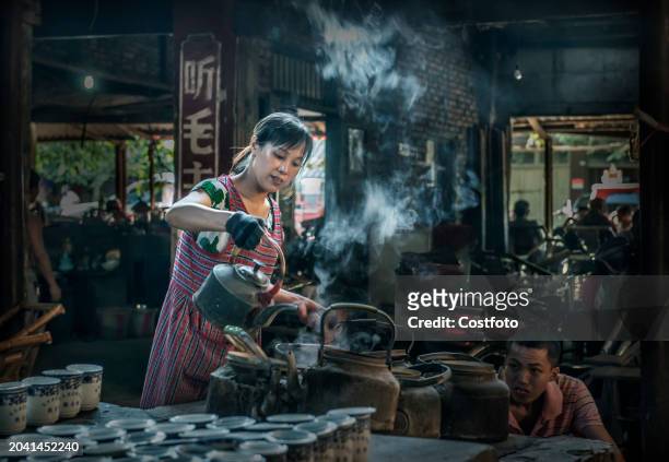 Photo taken on 24 July 2015 shows the Ancient Pengzhen Town Teahouse located on the old street in Pengzhen Town, about 30 km in the west of Chengdu,...