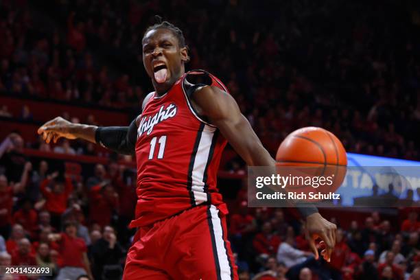 Clifford Omoruyi of the Rutgers Scarlet Knights reacts after a dunk against the Michigan Wolverines during the second half at Jersey Mike's Arena on...