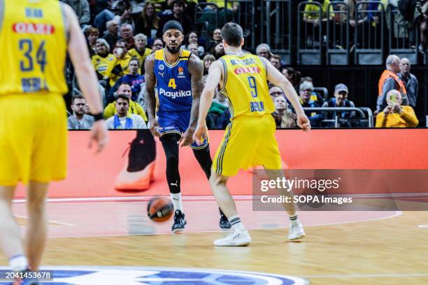 Lorenzo Brown of Maccabi Playtika Tel Aviv and Malte Delow of Alba Berlin seen in action during the Round 27 of the 2023/2024 Turkish Airlines...