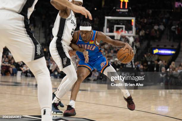 Guard Shai Gilgeous-Alexander of the Oklahoma City Thunder drive towards the basket during a game against the San Antonio Spurs at Frost Bank Center...