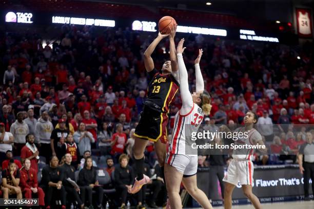 Trojans center Rayah Marshall shoots the ball over Arizona Wildcats forward Isis Beh during overtime of a women's basketball game between the USC...