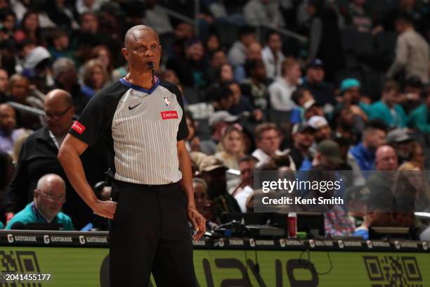 Referee Michael Smith looks on during the game between the Milwaukee Bucks and the Charlotte Hornets on February 29, 2024 at Spectrum Center in...