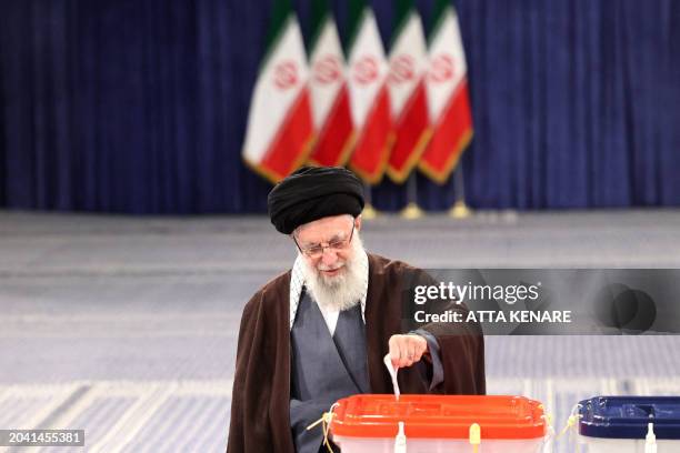 Iran's supreme leader Ayatollah Ali Khamenei casts his ballot during the parliamentary and key clerical body elections at a polling station in Tehran...