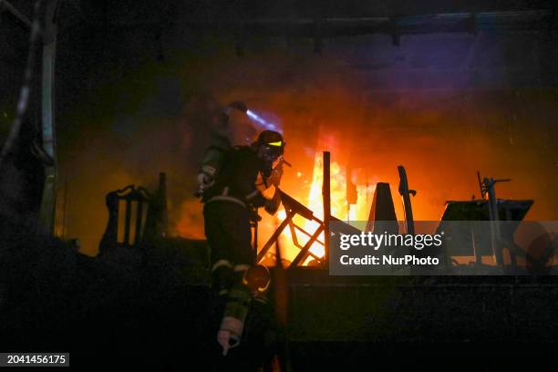 Firefighters are rescuing people from the roof after a fire broke out in a multi-story building in Dhaka, Bangladesh, on February 29, 2024. At least...