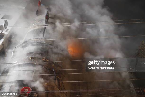 Firefighters are working to extinguish a fire in a commercial building that has killed at least 43 people in Dhaka, Bangladesh, on February 29, 2024....