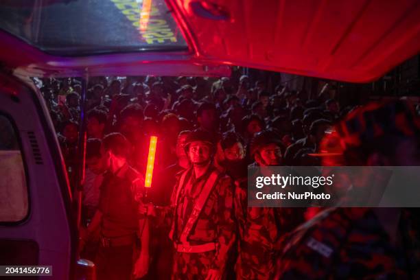 Personnel is reacting to the camera while on duty at the site of a fire that broke out in a commercial building in Dhaka, Bangladesh, on February 29,...