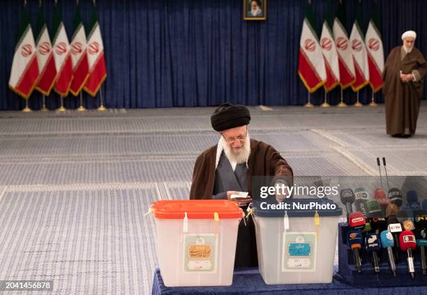 Iran's Supreme Leader Ayatollah Ali Khamenei is casting his ballot during the Iranian Parliamentary and Assembly of Experts elections at the...