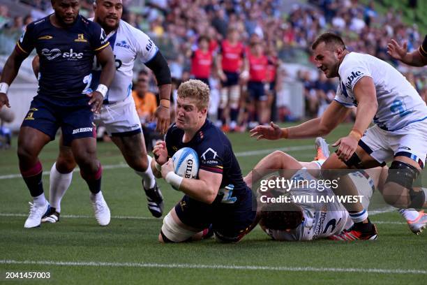 Highlanders player Sean Withy dives over to score a try during the Super Rugby match between the Auckland Blues and the Otago Highlanders in...