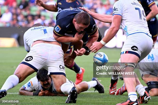 Highlanders player Ethan De Groot loses the ball in a tackle by Blues player Ofa Tu'ungafasi during the Super Rugby match between the Auckland Blues...