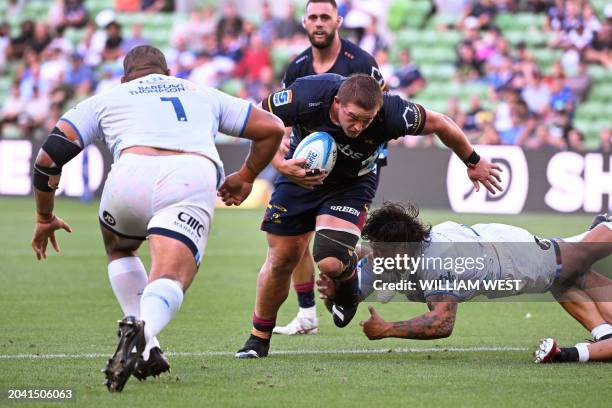 Highlanders player Ethan De Groot is tackled by Blues player Ofa Tu'ungafasi during the Super Rugby match between the Auckland Blues and the Otago...