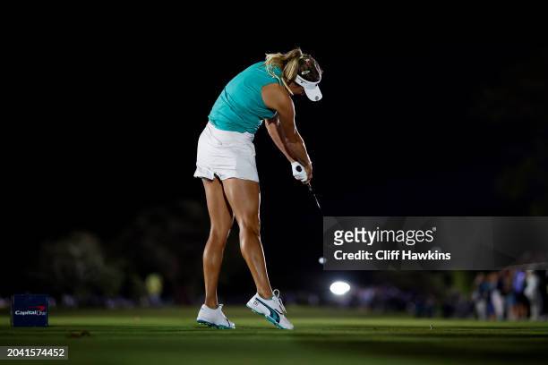 Lexi Thompson plays her shot from the first tee during Capital One's The Match IX at The Park West Palm on February 26, 2024 in West Palm Beach,...