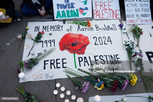 People leave notes and flowers during a vigil for U.S. Air Force active-duty airman Aaron Bushnell outside the Israeli Embassy on February 26, 2024...