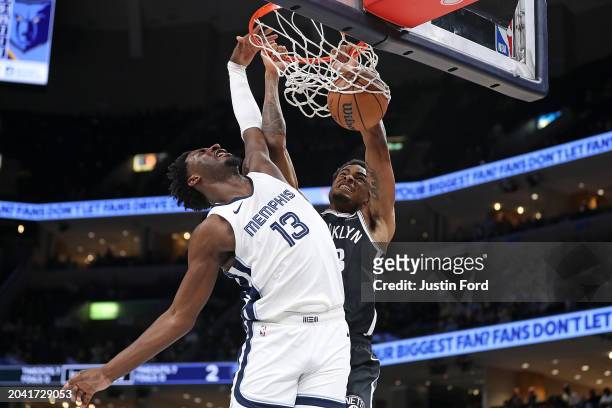 Nic Claxton of the Brooklyn Nets dunks against Jaren Jackson Jr. #13 of the Memphis Grizzlies during the first half at FedExForum on February 26,...