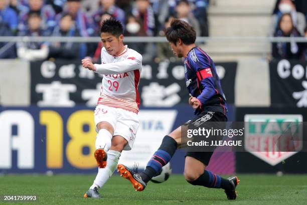 Ryuji Izumi of Nagoya Grampus controls the ball against Genta Miura of Gamba Osaka during the J.League J1 match between Gamba Osaka and Nagoya...