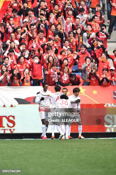 Jo of Nagoya Grampus celebrates with teammates after scoring the team's third goal during the J.League J1 match between Gamba Osaka and Nagoya...