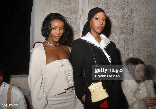 Davinhor Pacman and Hodan Yousuf attend the Pressiat Womenswear Fall/Winter 2024-2025 show as part of Paris Fashion Week on February 26, 2024 in...