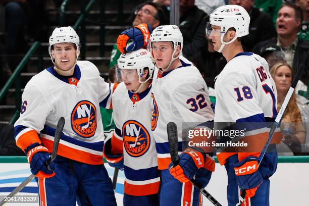 Kyle MacLean of the New York Islanders celebrates with Ryan Pulock, Sebastian Aho and Pierre Engvall of the New York Islanders after scoring during...