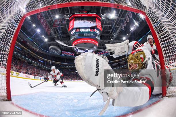 Goalie Joonas Korpisalo of the Ottawa Senators cannot make a save on a shot by Hendrix Lapierre of the Washington Capitals during the second period...