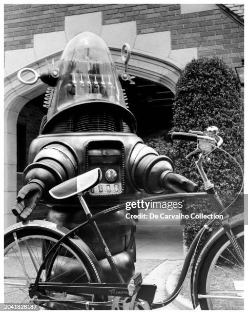 Publicity portrait of Robby the Robot beside a bicycle/bike in his second cinematic appearance, 'The Invisible Boy' United States.