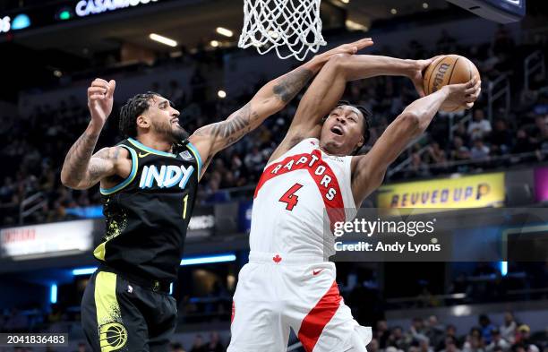 Scottie Barnes of the Toronto Raptors shoots the ball while defended by Obi Toppin of the Indiana Pacers at Gainbridge Fieldhouse on February 26,...