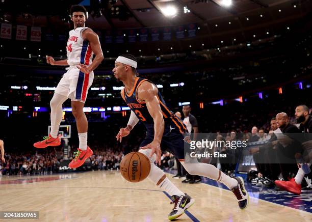 Josh Hart of the New York Knicks heads for the net as Quentin Grimes of the Detroit Pistons defends during the fourth quarter at Madison Square...