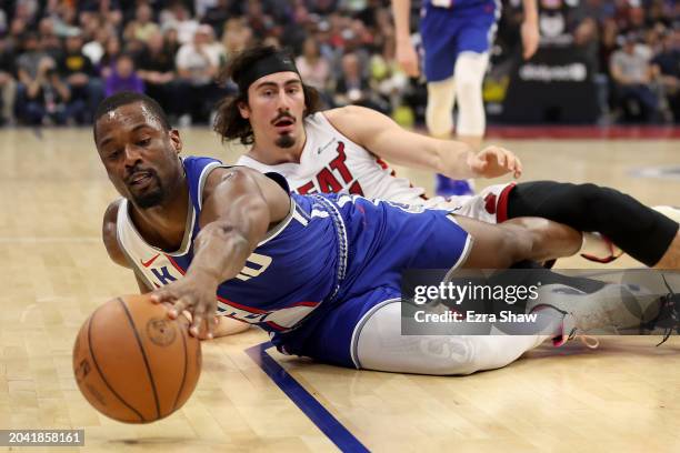 Harrison Barnes of the Sacramento Kings and Jaime Jaquez Jr. #11 of the Miami Heat go for a loose ball in the first half at Golden 1 Center on...