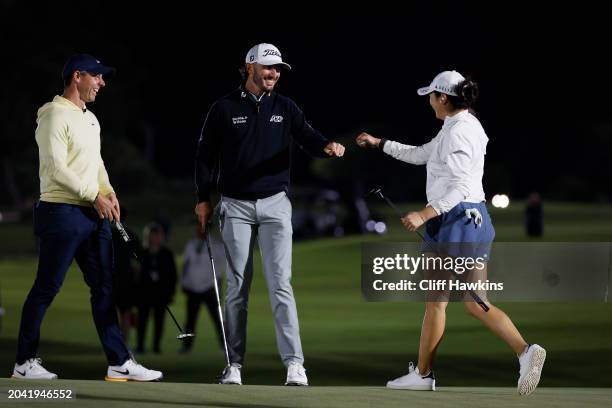Rory McIlroy, Max Homa and Rose Zhang react on the 12th green during Capital One's The Match IX at The Park West Palm on February 26, 2024 in West...