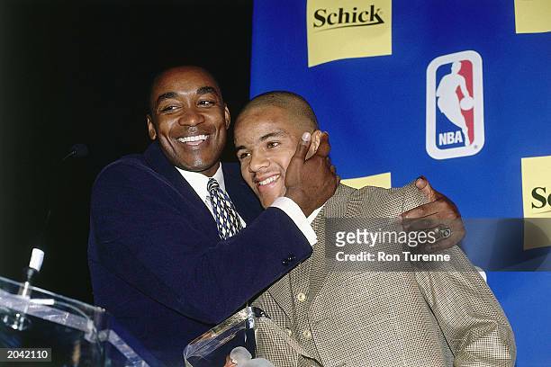 Damon Stoudamire of the Toronto Raptors poses for a portrait with Isiah Thomas during the Rookie of the Year press conference on May 15, 1996 in...