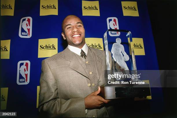Damon Stoudamire of the Toronto Raptors poses for a portrait after receiving the Rookie of the Year Trophy on May 15, 1996 in Toronto, Canada. NOTE...