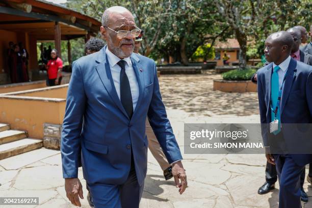 Haitian Prime Minister Ariel Henry, leaves the auditorium after speaking to students during a public lecture on bilateral engangement between Kenya...