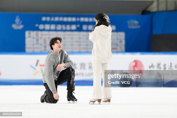 Liu Xinyu and Wang Shiyue acknowledge the crowd following the Figure Skating Gala Exhibition of the China's 14th National Winter Games on February...