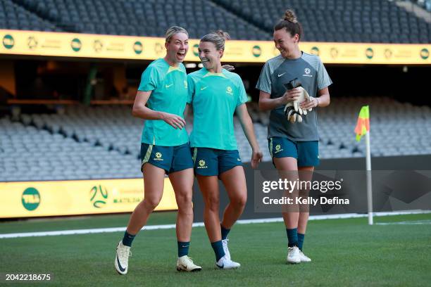 Alanna Kennedy of Australia, Steph Catley of Australia and Mackenzie Arnold of Australia arrive during an Australia Matildas press conference at...
