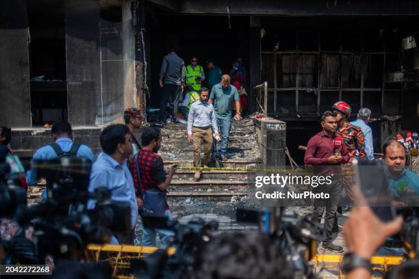Firefighters and forensic experts are inspecting a commercial building in Dhaka, Bangladesh, on March 1 the day after a fire claimed the lives of 45...