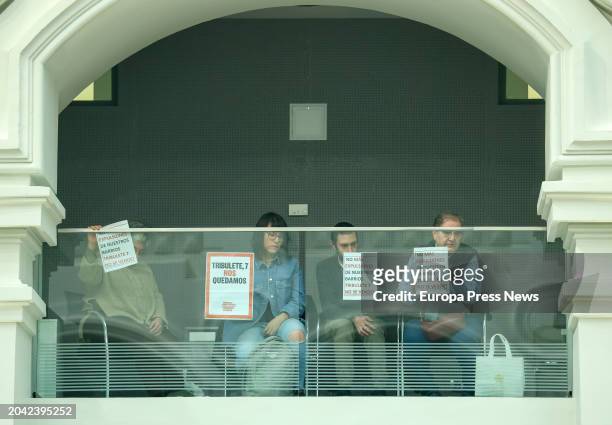 Members of the Madrid Union of Tenants protest with placards during a plenary session at the Madrid City Hall, at the Cibeles Palace, February 27 in...