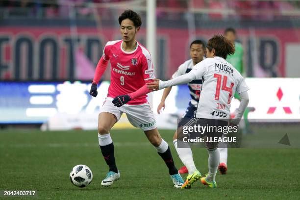 Kenyu Sugimoto of Cerezo Osaka controls the ball against Jun Amano of Yokohama F.Marinos during the J.League J1 match between Cerezo Osaka and...