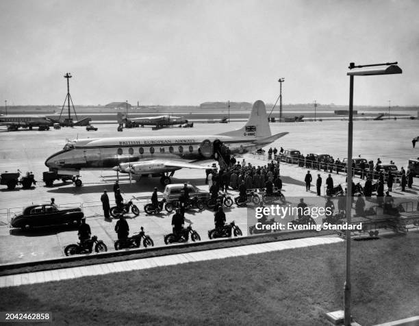 Soviet leader Nikita Khruschev and Soviet Premier, Nikolai Bulganin boarding a BEA Viscount plane with their delegation at London Airport, April 27th...