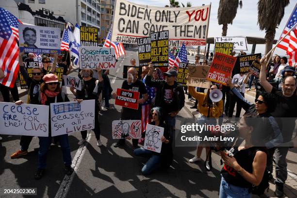 Families and supporters of hostages held in Gaza protest in-front of the US embassy branch of Tel Aviv as they are calling for the help of US...
