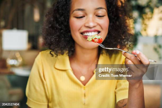 savoring a fresh salad bite - loosing weight stock pictures, royalty-free photos & images