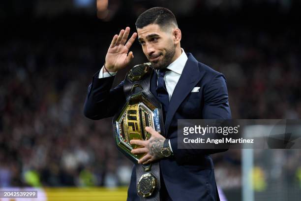 Ilia Topuria, UFC Featherweight Champion, is seen with his belt on the pitch prior to the LaLiga EA Sports match between Real Madrid CF and Sevilla...